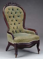 Appraisal: CARVED WALNUT UPHOLSTERED LADY S ARMCHAIR Rose carved crest finger