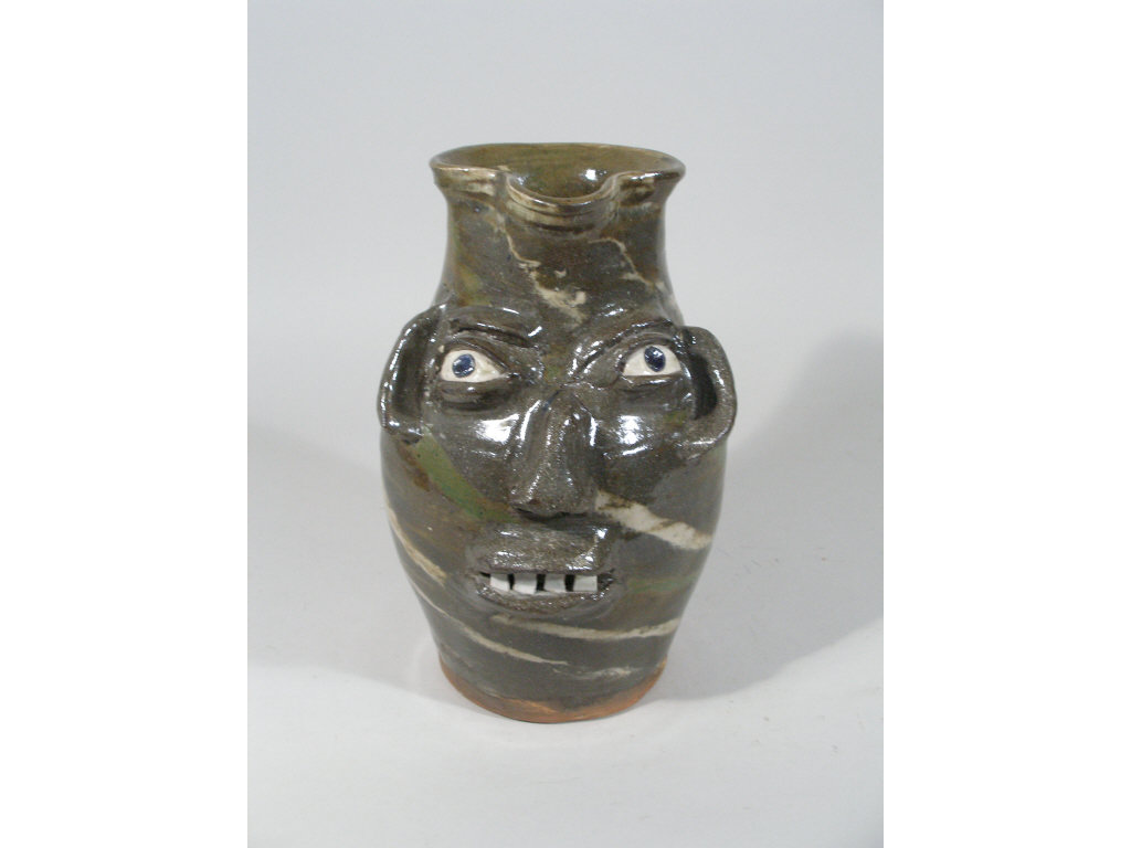 Appraisal: NC Folk Pottery Burlon Craig Face Pitcher swirlware distinctive applied