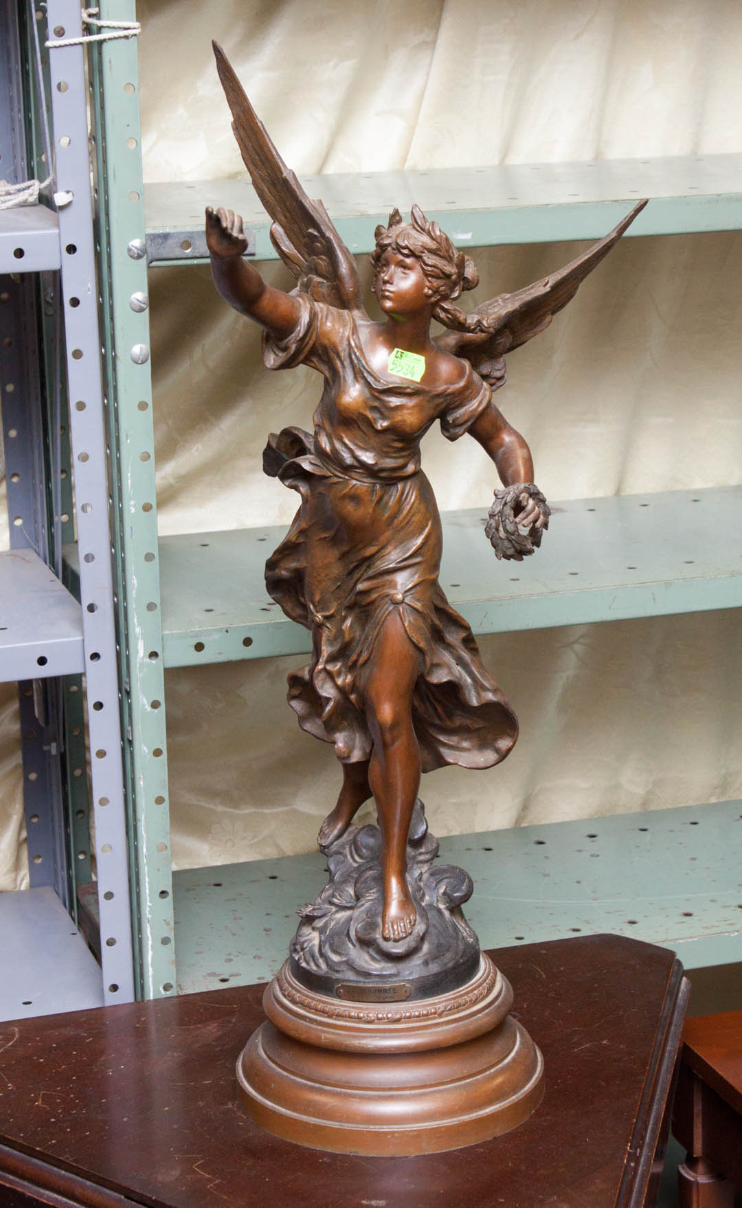 Appraisal: Metal winged female statue possibly Victory signed and stamped on