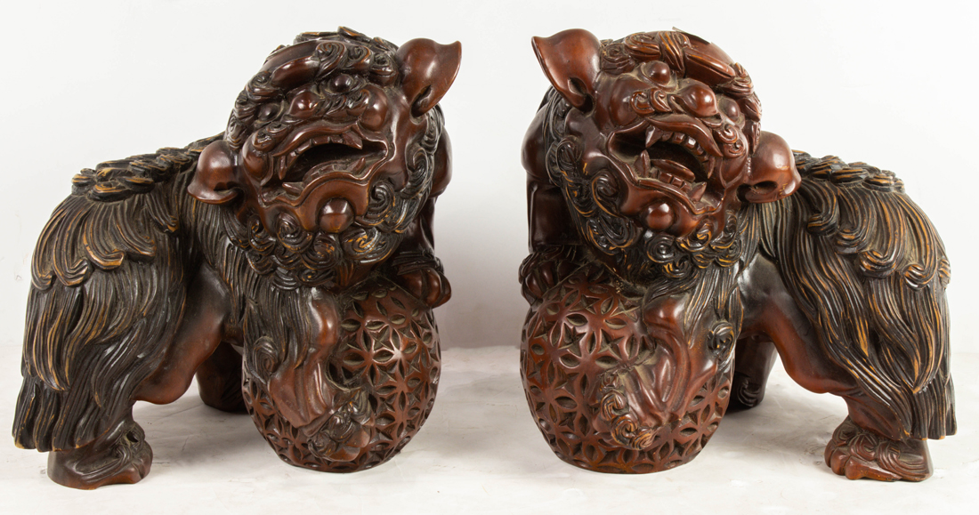 Appraisal: PAIR OF CHINESE ELMWOOD FU LION FIGURES Pair of Chinese