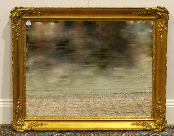 Appraisal: A gilt and composition framed wall mirror cm x cm