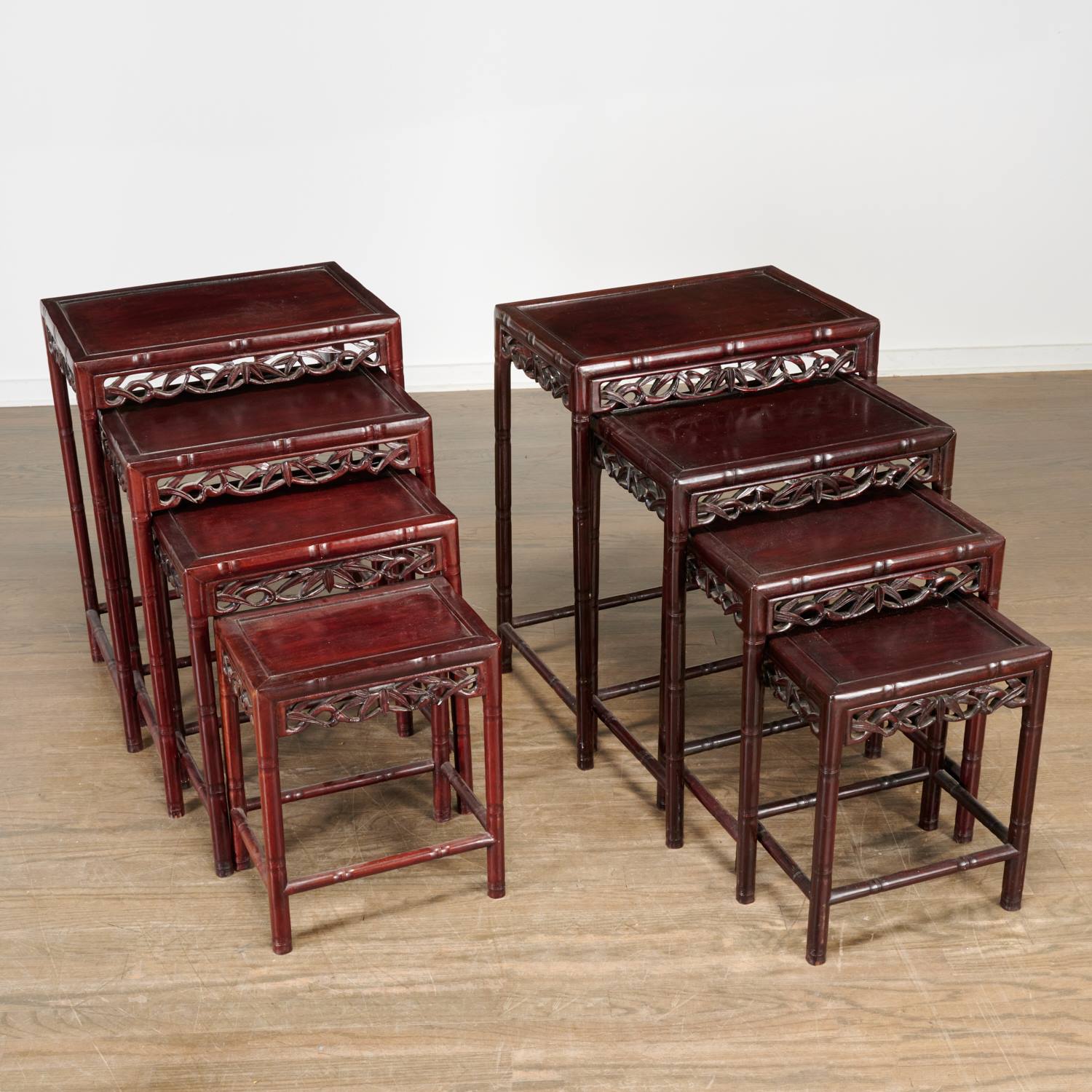 Appraisal: PAIR CHINESE CARVED HARDWOOD NESTING TABLES th c China bamboo-carved