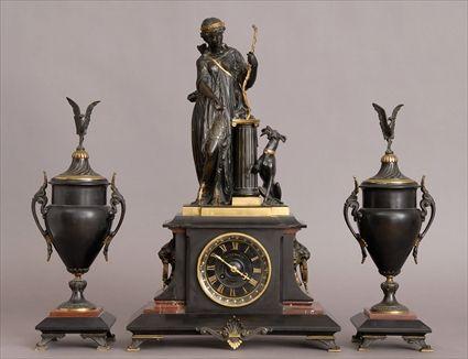 Appraisal: FRENCH BRONZED AND GILT-METAL MOUNTED BLACK MARBLE THREE-PIECE CLOCK GARNITURE