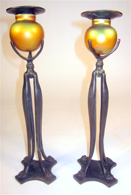 Appraisal: Pair of Art Nouveau Bronze and iridescent glass candlesticksThe iridescent