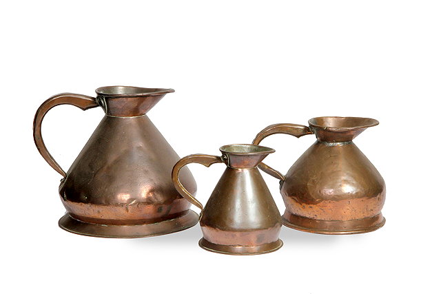 Appraisal: A MATCHED GRADUATED SET OF THREE TH CENTURY COPPER LIQUID