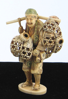 Appraisal: A JAPANESE CARVED IVORY FIGURE OF A PEDDLER The man