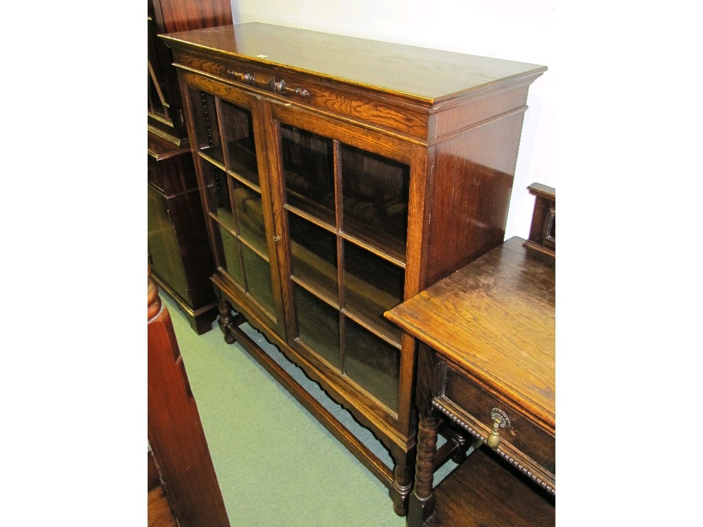 Appraisal: Oak glazed door bookcase