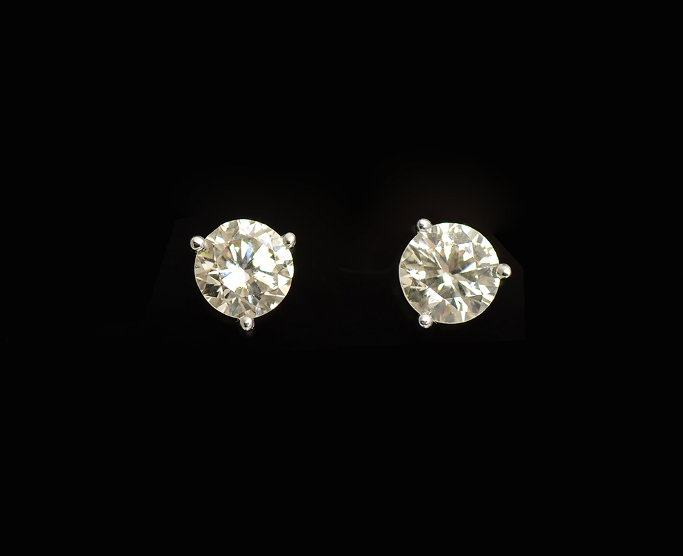 Appraisal: K CT MARTINI SET DIAMOND EAR STUDS Modern and sophisticated