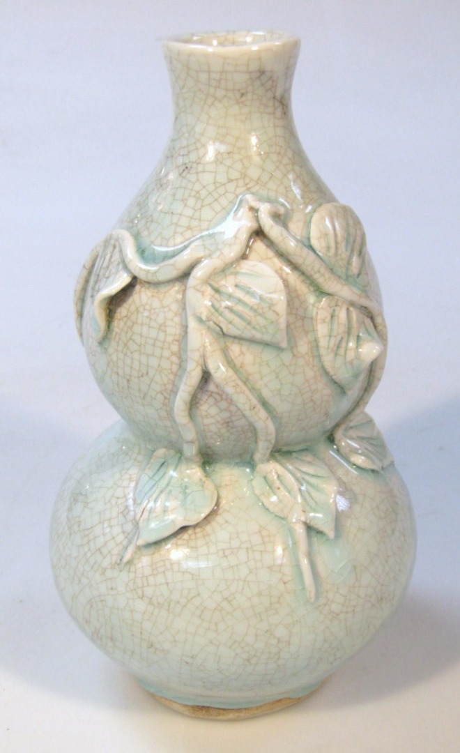 Appraisal: A Chinese celadon double gourd vase in turquoise raised with