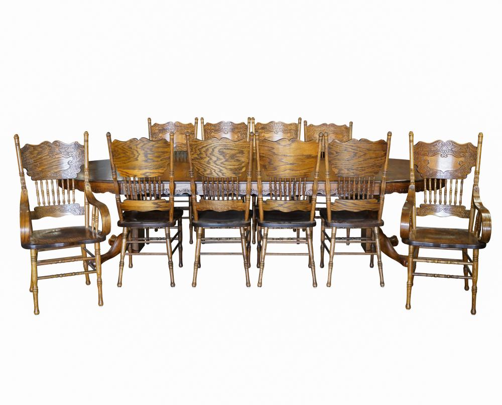 Appraisal: AMERICAN OAK DINING SETcomprising an expandable oak table with three