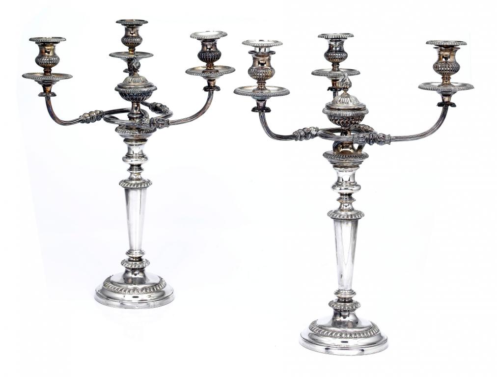 Appraisal: A PAIR OF VICTORIAN THREE-BRANCH CANDELABRA with waisted or vase