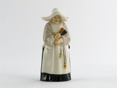 Appraisal: A Royal Worcester candle snuffer modelled as a nun printed