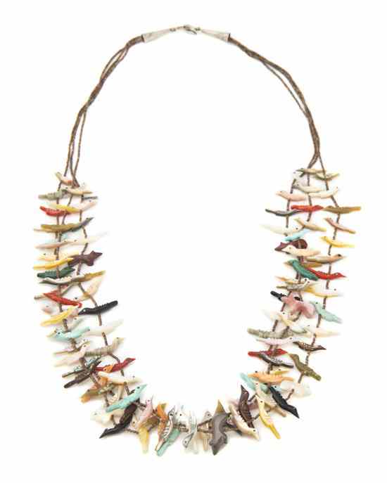 Appraisal: A Zuni Three Strand Fetish Necklace with hand carved birds