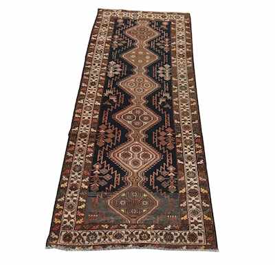 Appraisal: A Serapi Rug Neutral tones of brown black ivory and