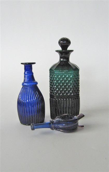 Appraisal: Three glass bottles One cobalt blue with ribbing one green