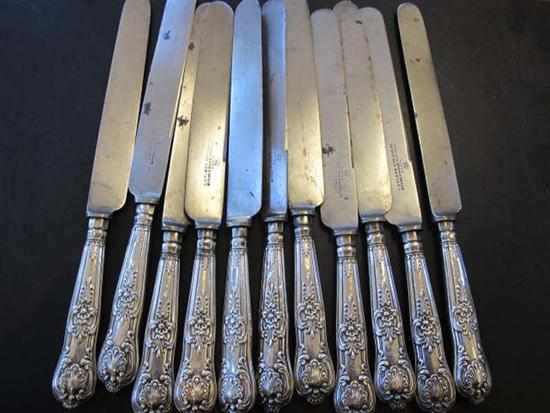 Appraisal: STERLING SILVER HANDLED QUEENS PATTERN KNIVES