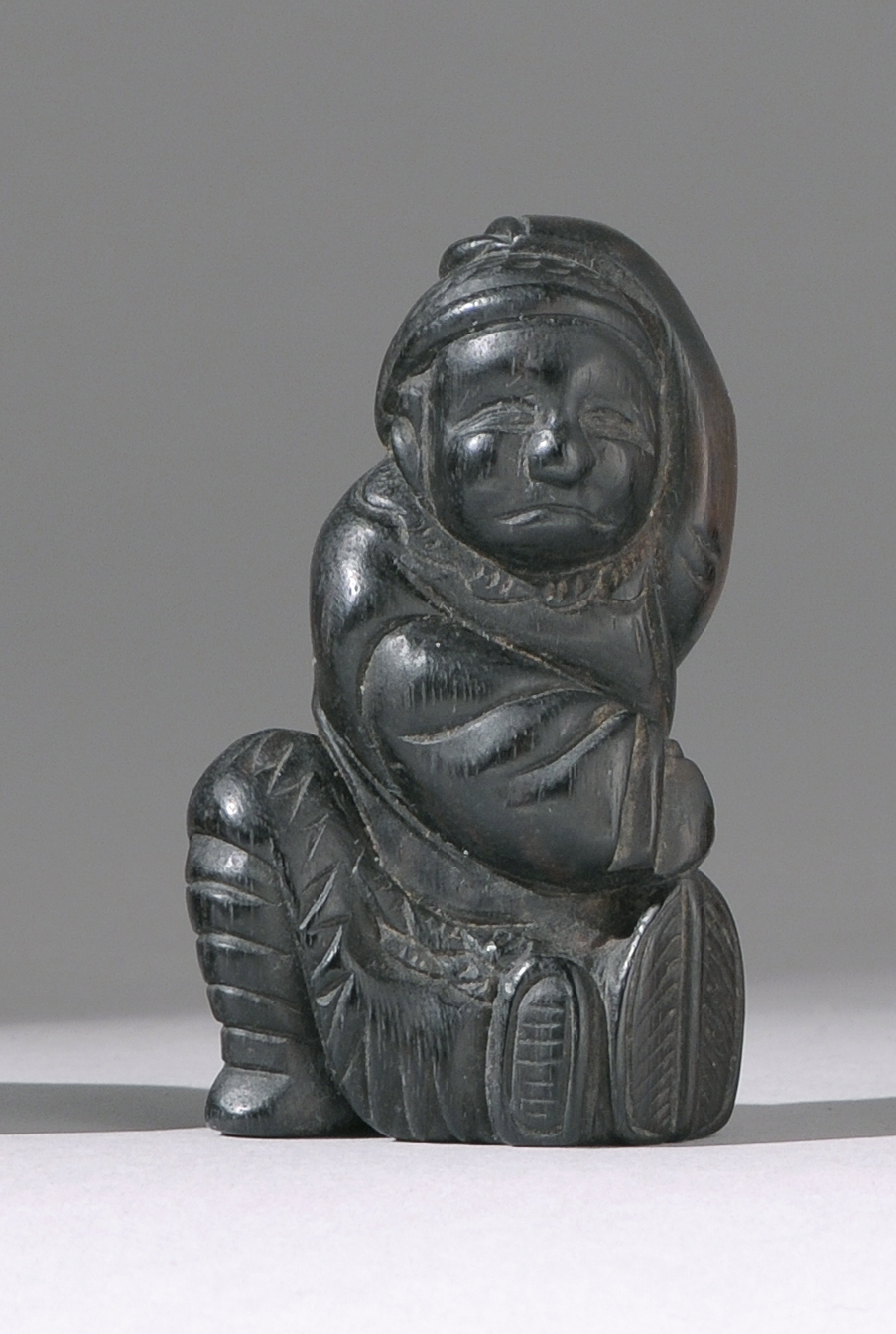 Appraisal: EBONY NETSUKE th CenturyIn the form of a man in