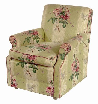 Appraisal: An easy armchair covered with Colefax and Fowler chintz fabric