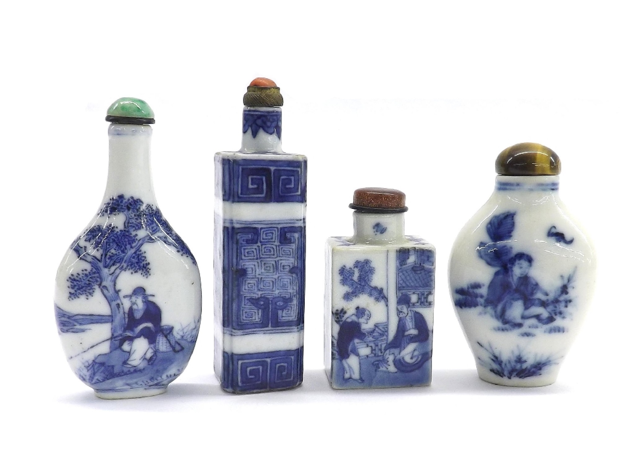 Appraisal: Four various blue and white snuff bottles