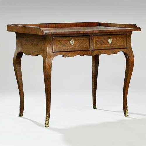 Appraisal: A German Rococo Figured Walnut Writing Desk circa having an