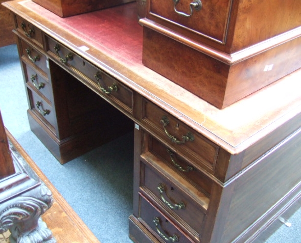 Appraisal: An Edwardian mahogany twin pedestal desk of George III design