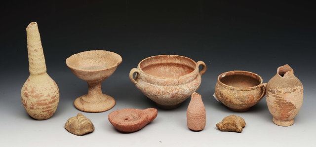 Appraisal: A GROUP OF CLAY ANTIQUITIES to include a stem cup