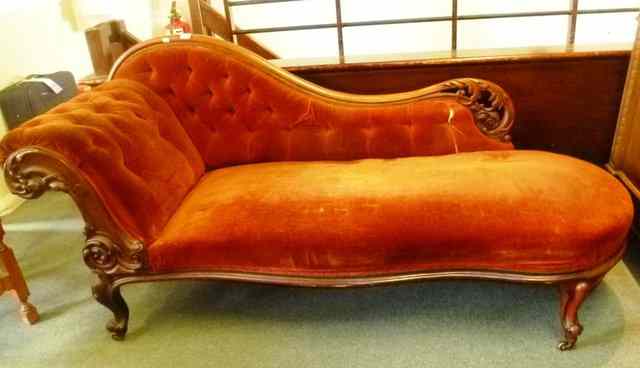 Appraisal: A VICTORIAN WALNUT CHAISE LONGUE of shaped form with button