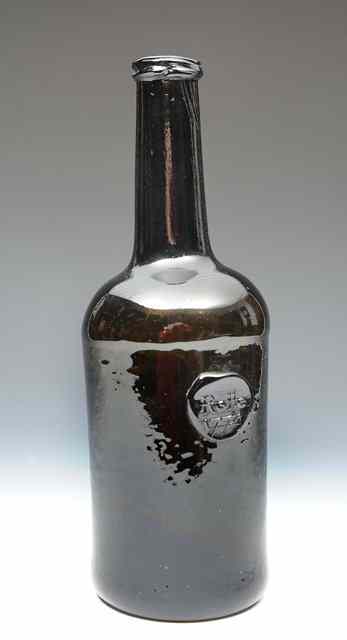 Appraisal: A GEORGE III CYLINDRICAL GLASS WINE BOTTLE with seal impressed