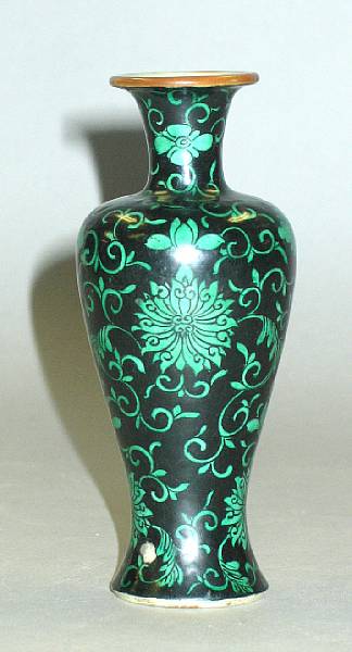 Appraisal: A famille noire enameled porcelain miniature vase th Century Of