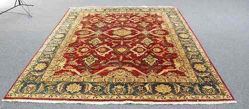 Appraisal: A Kashmiri carpet Indian th Century palmettes on a madder