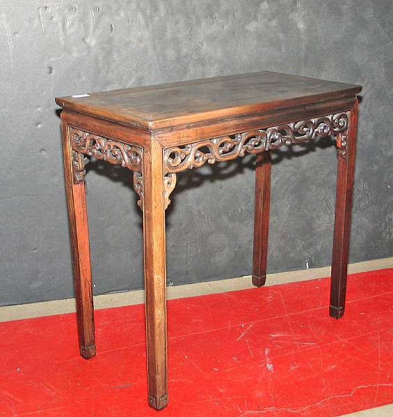 Appraisal: A Chinese wood rectangular side table With a floating panel