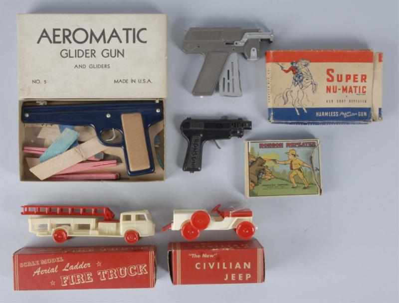 Appraisal: Lot of Toy Guns Vehicles Description Includes two plastic vehicles