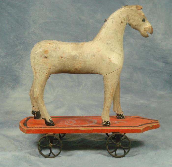 Appraisal: Painted carved wood horse pull toy iron wheels l h