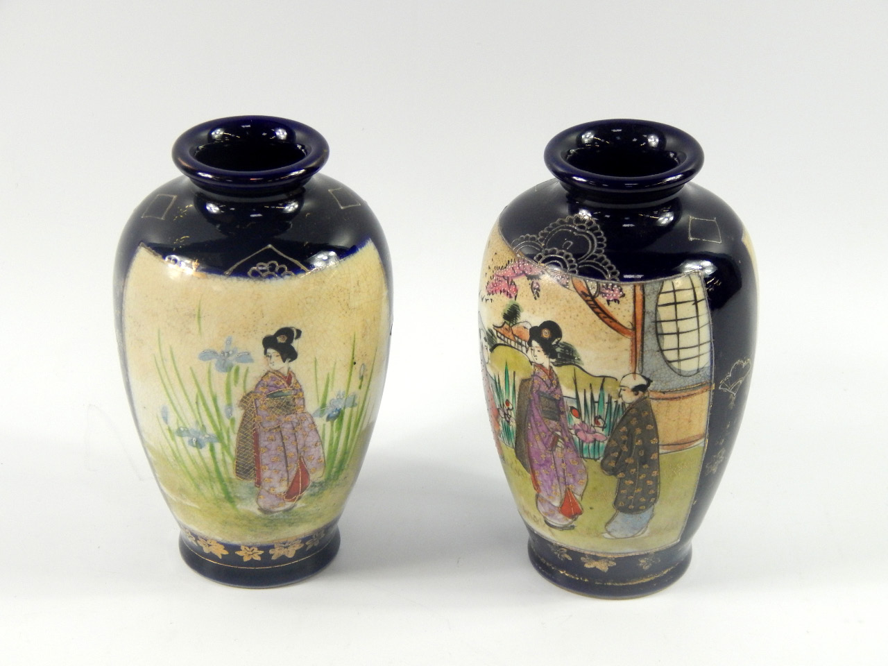 Appraisal: A pair of Satsuma pottery vases decorated with reserves of