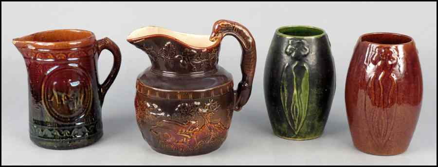 Appraisal: TWO BENNINGTON STYLE POTTERY PITCHERS Together with two glaze earthenware