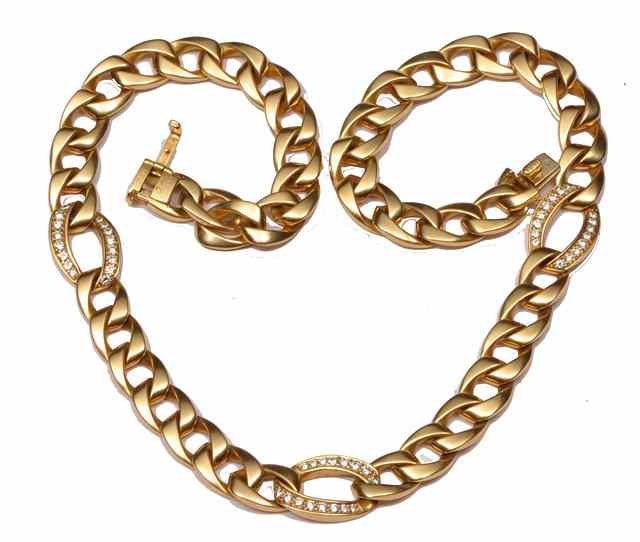 Appraisal: A GOLD AND DIAMOND FLAT CURB LINK NECKLACE with three