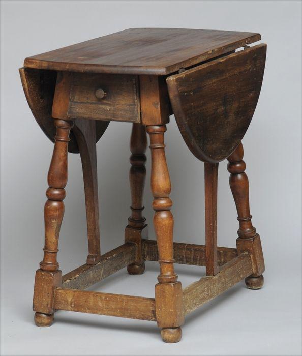 Appraisal: NEW ENGLAND MAPLE BUTTERFLY TABLE The rectangular top with hinged