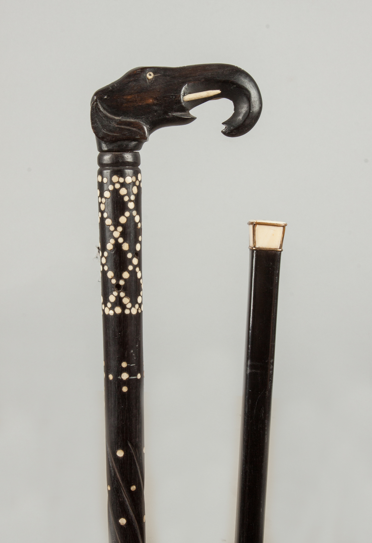 Appraisal: Two Ebonized Decorative Canes Late th early th century Inlaid