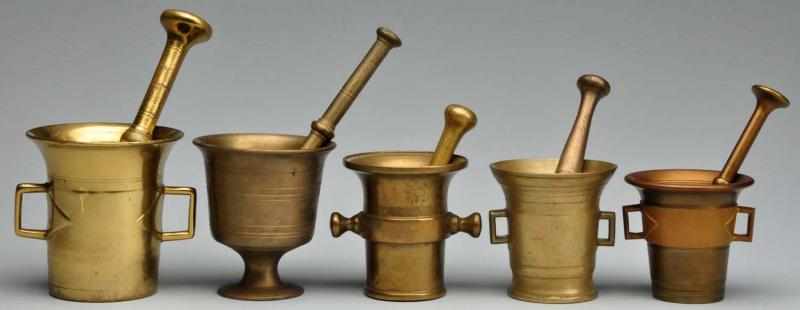 Appraisal: Lot of Brass Mortars Pestles Description Circa to Three brass