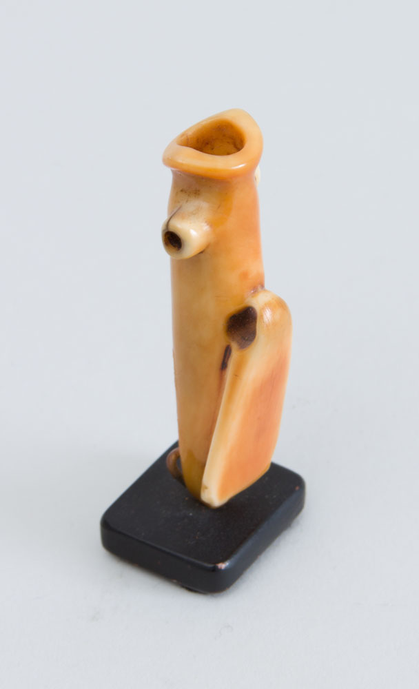 Appraisal: PENDE CARVED BONE WHISTLE Raised on a base Overall x