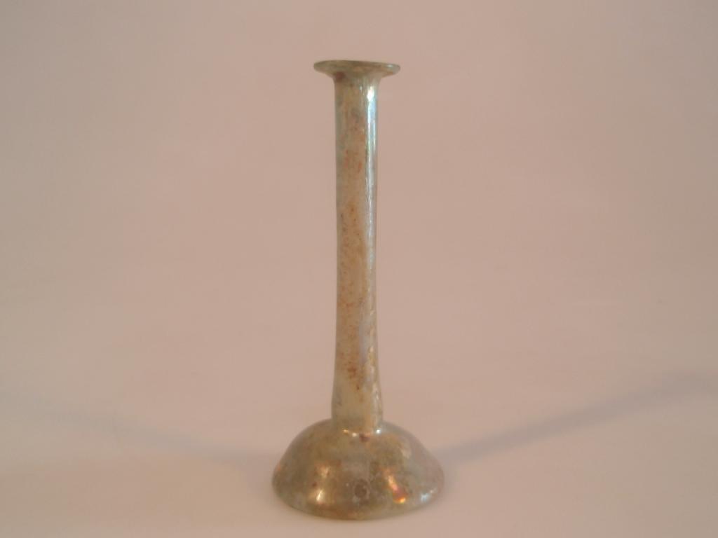 Appraisal: A Roman light green glass 'candlestick' unguentarium the everted mouth