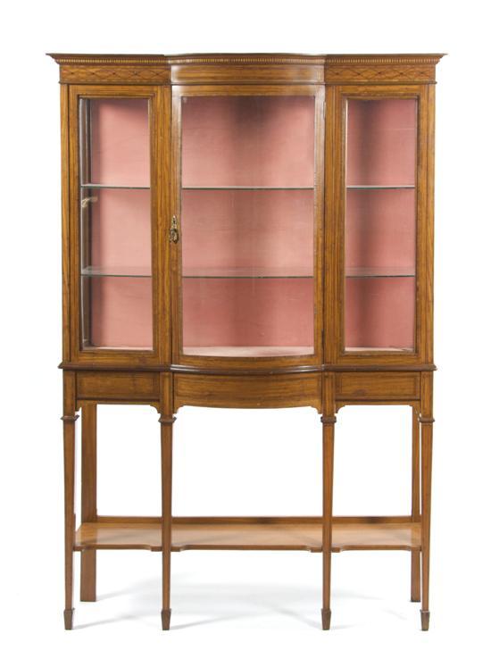 Appraisal: n Edwardian Satinwood Vitrine on Stand having a central bow