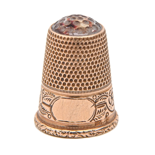 Appraisal: A Victorian gold thimble with amethyst glass top and foliate