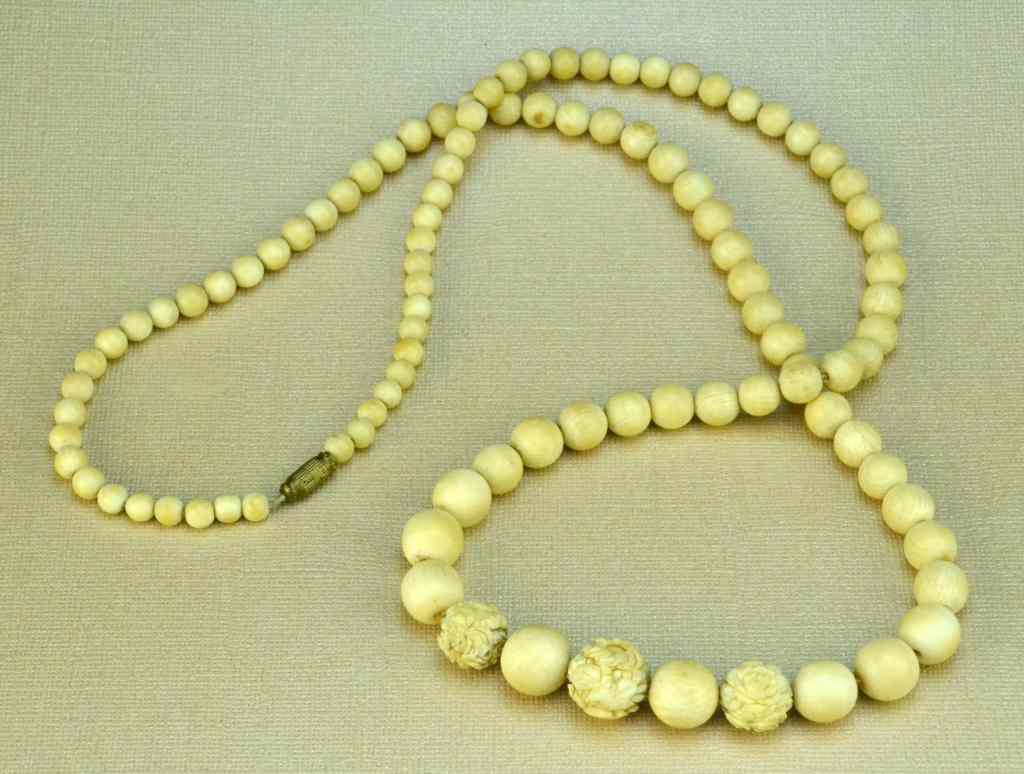 Appraisal: Chinese Carved Ivory NecklaceConsisting of over circular ivory beads graduating