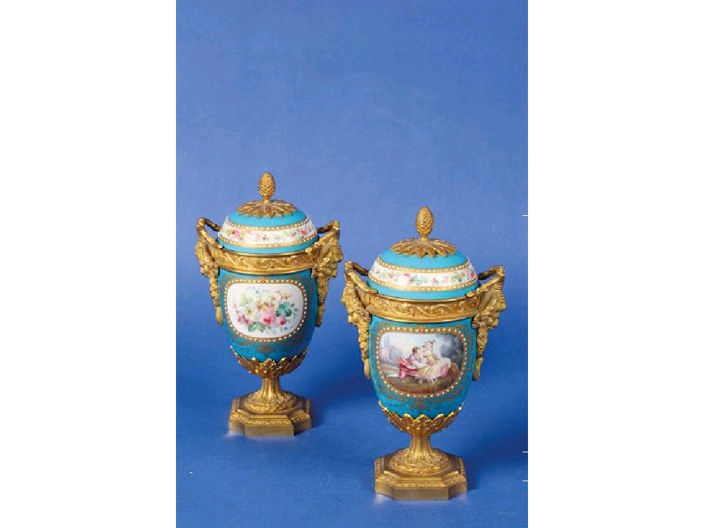 Appraisal: A PAIR OF SEVRES STYLE PORCELAIN AND ORMOLU PEDESTAL VASES