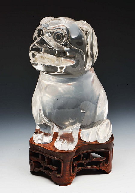 Appraisal: A CHINESE ROCK CRYSTAL SEATED DOG OF FO on a