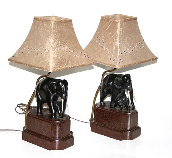 Appraisal: A pair of ebonized and ivory mounted elephant form table