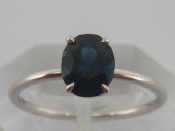 Appraisal: A white metal tests carat gold sapphire ring accompanied by