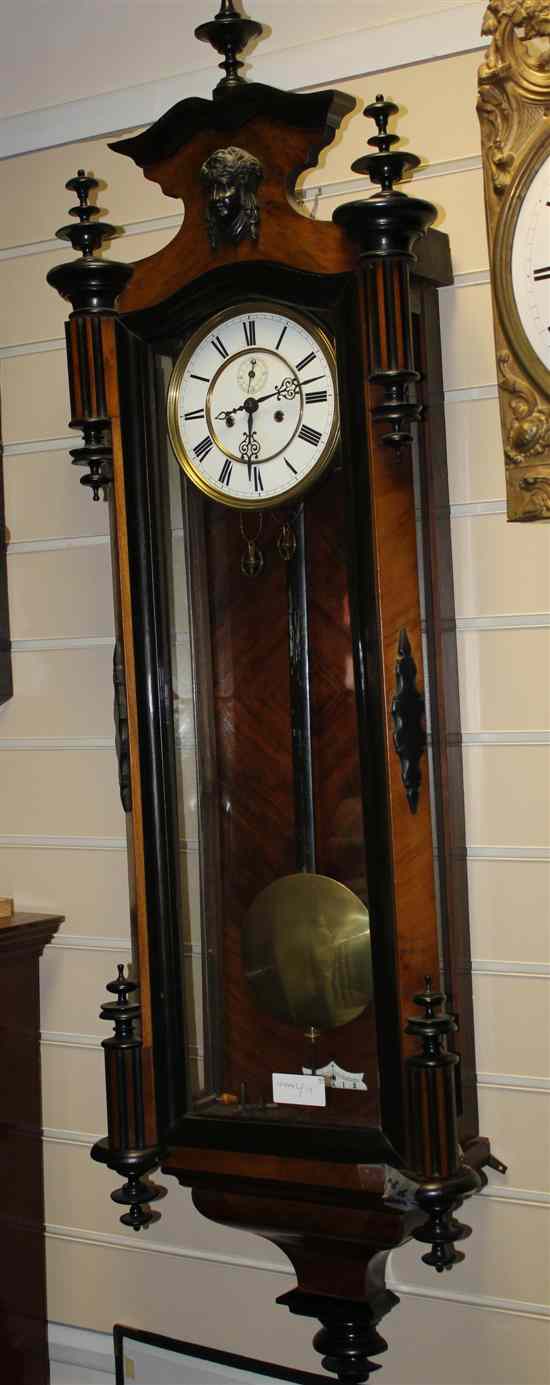 Appraisal: A late th century parcel ebonised walnut Vienna wall clock