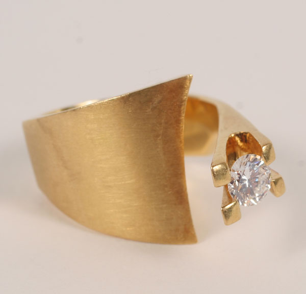 Appraisal: Gold K modernist design assymetrical ring set with round brilliant